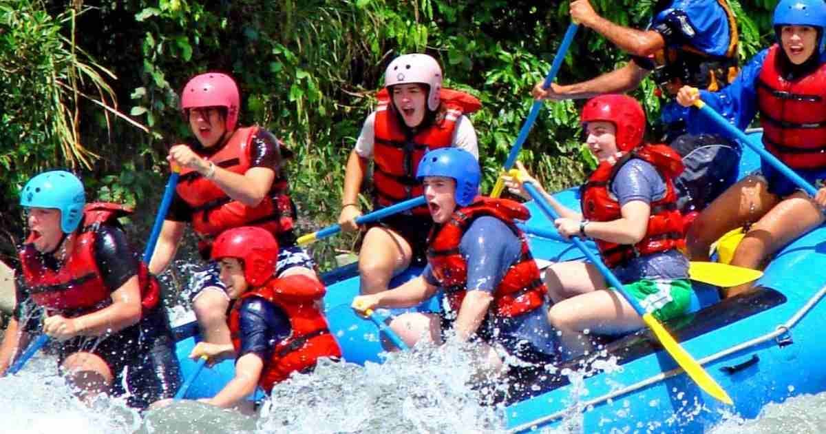 A Group Of People White Water Rafting In Ecuador