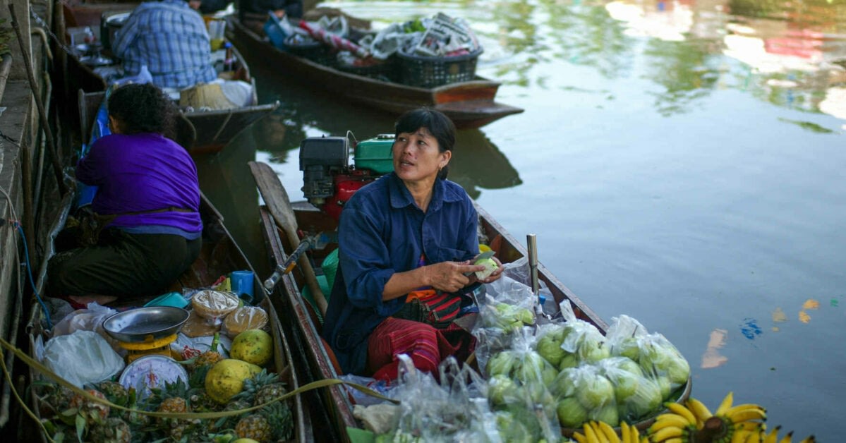 Bangkok City Guide 6 Women on boats with produce to sell