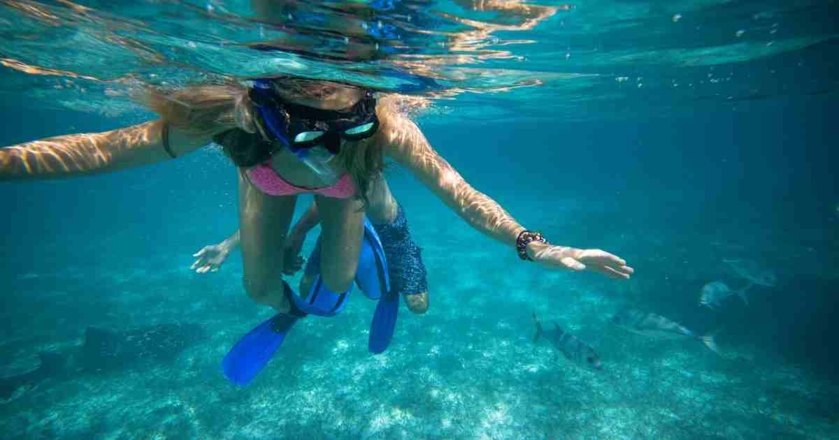 Girl Snorkelling On Coral Reef In Belize