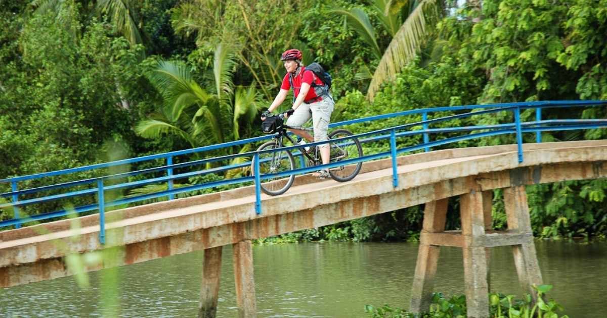 Person cycling over a bridge in Hanoi
