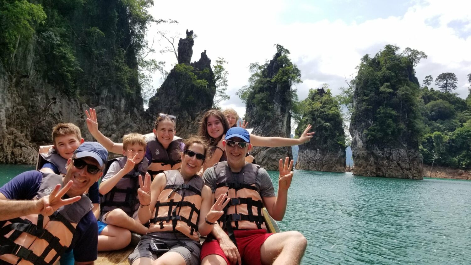 2025 Travel Trends You’ll Want to Join 6 Family group on boat in Thailand