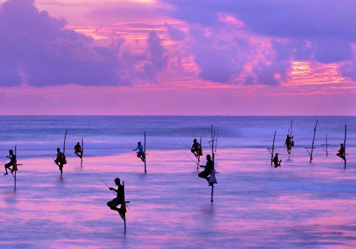Making Your Holiday Pennies Stretch 13 fishermen on stilts in the sea in sri lanka